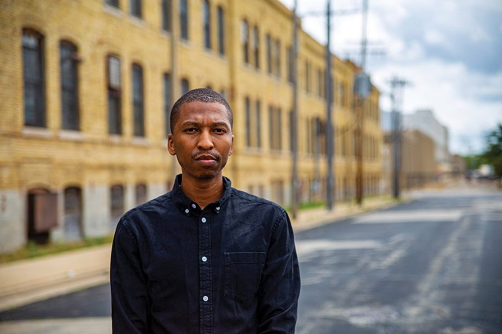 Man standing outside building exterior