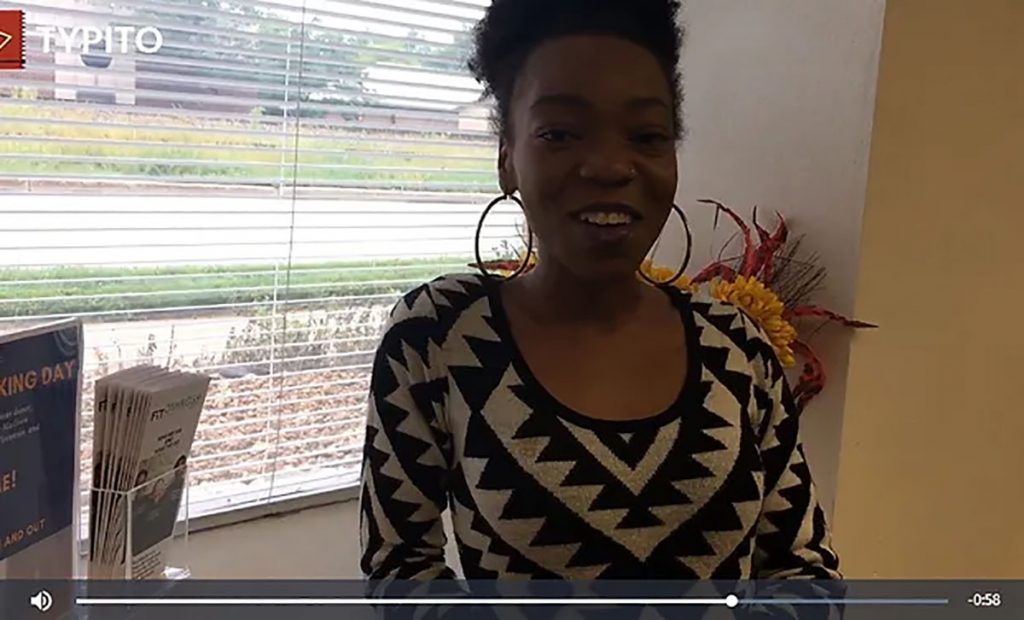 woman wearing black and white shirt in video