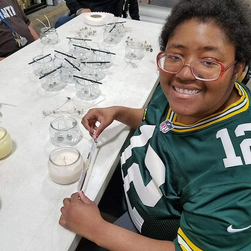 person making a diy candle