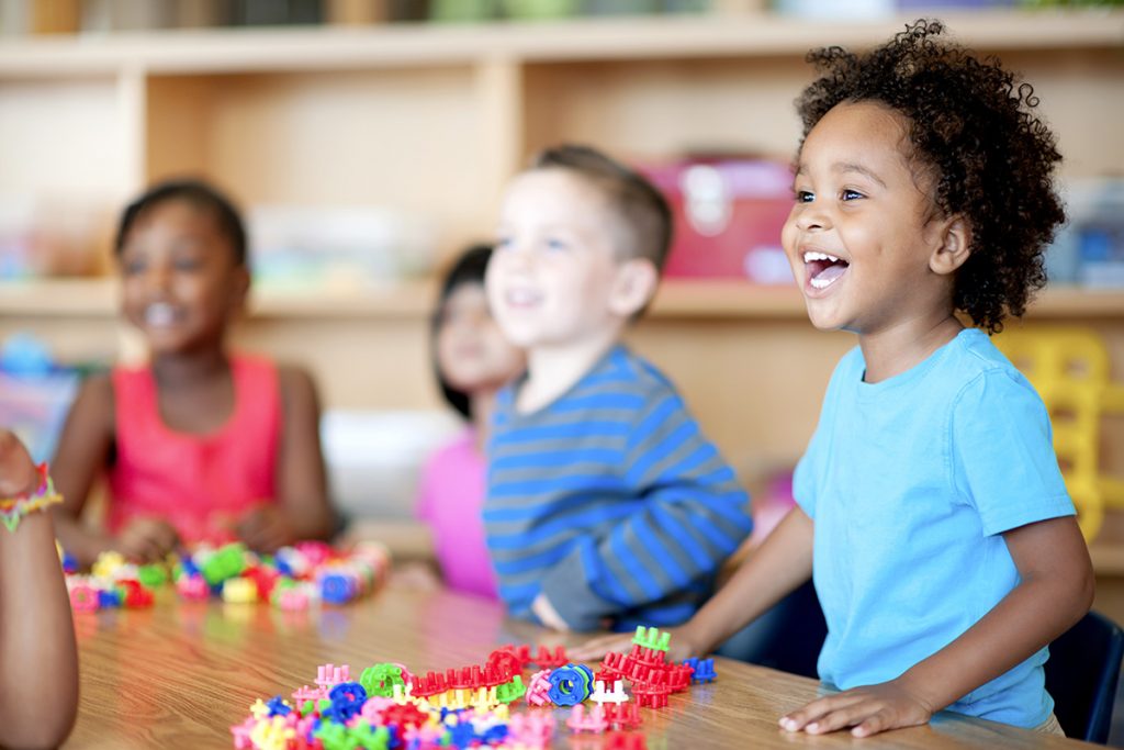 Small child excited while being in a school setting