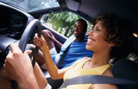 teen girl learning how to drive by her dad