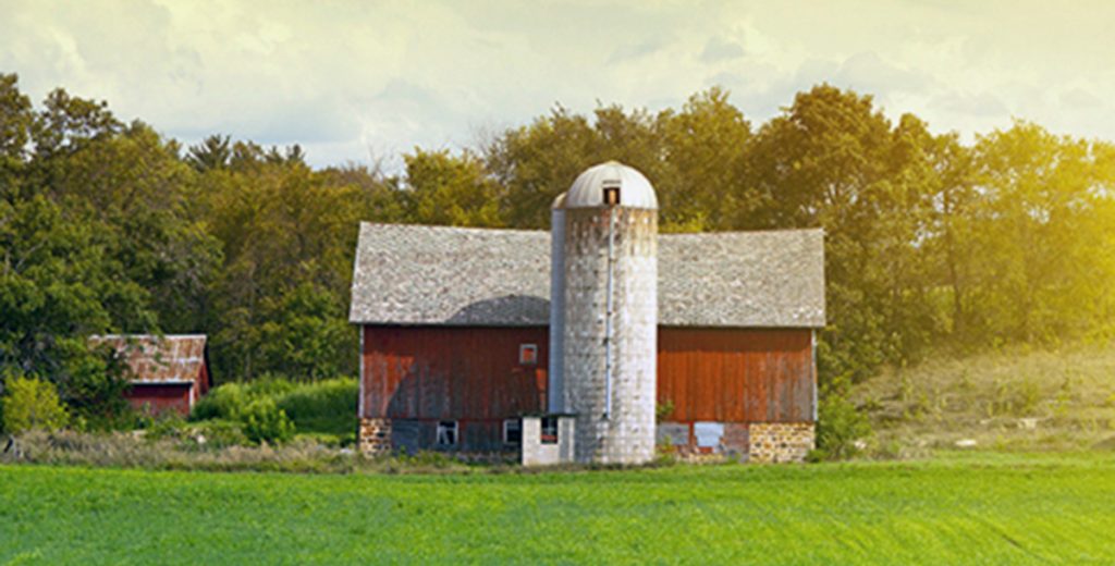 red barn in farm field