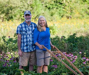 Older Couple standing in flower fields